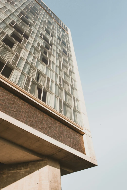 view from the ground up to the glassy building