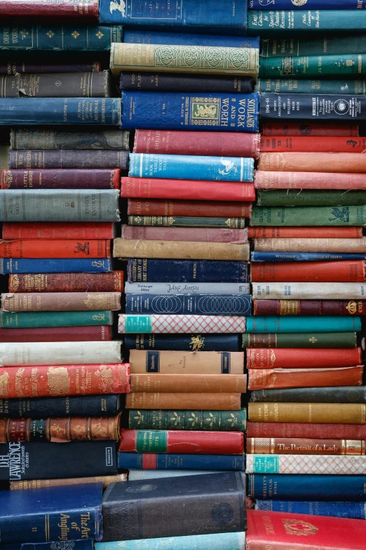 a pile of books stacked next to each other