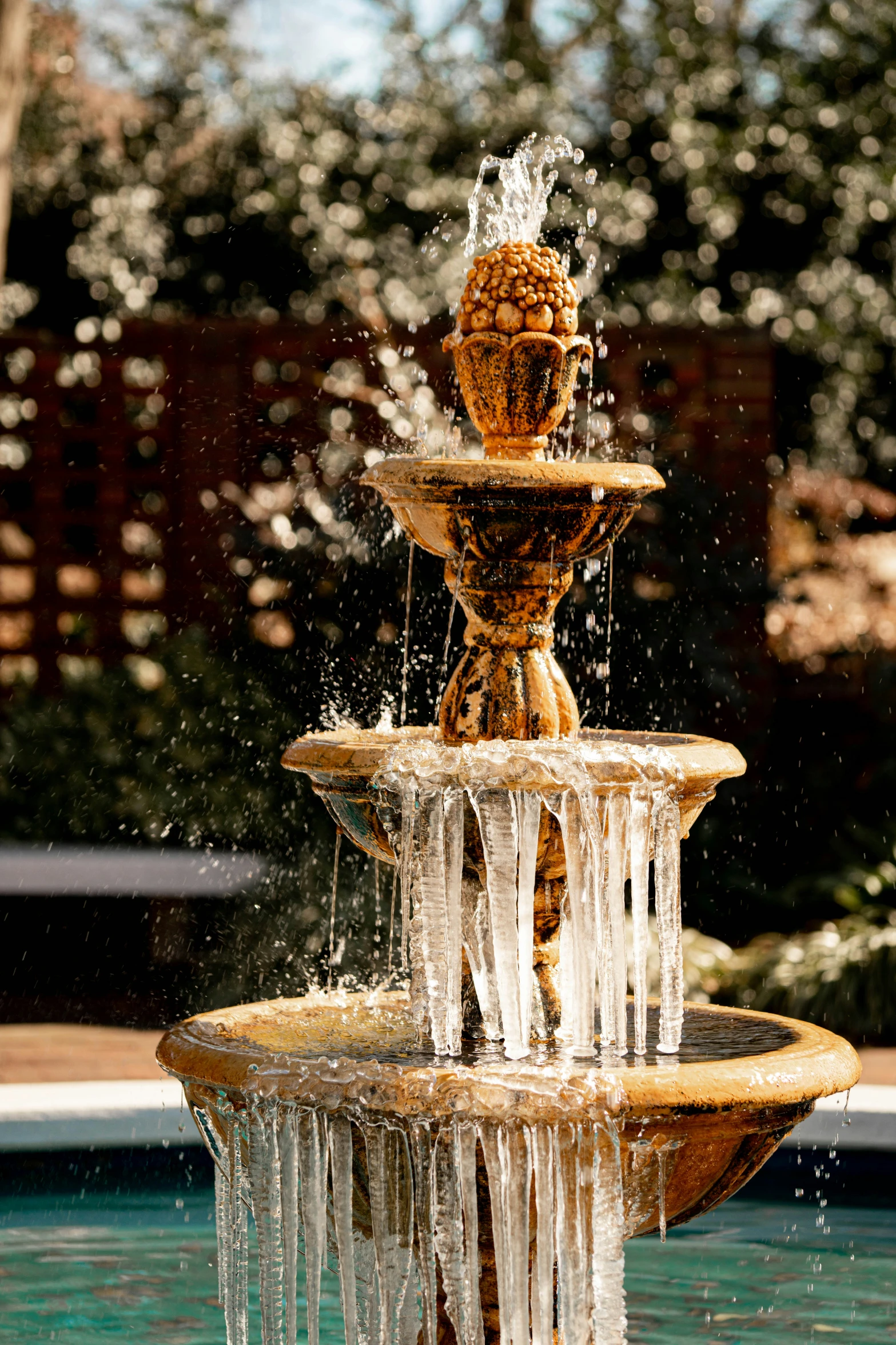 a fountain is seen with water dripping from it