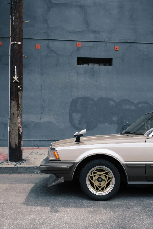 the front of a car is parked on the street