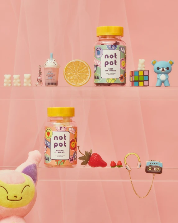 a pink shelf with many small toy items sitting on it