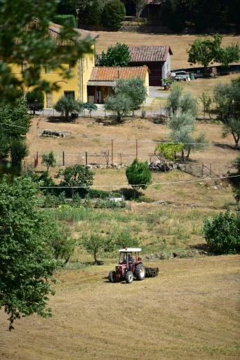farm field with two vehicles sitting on the lawn