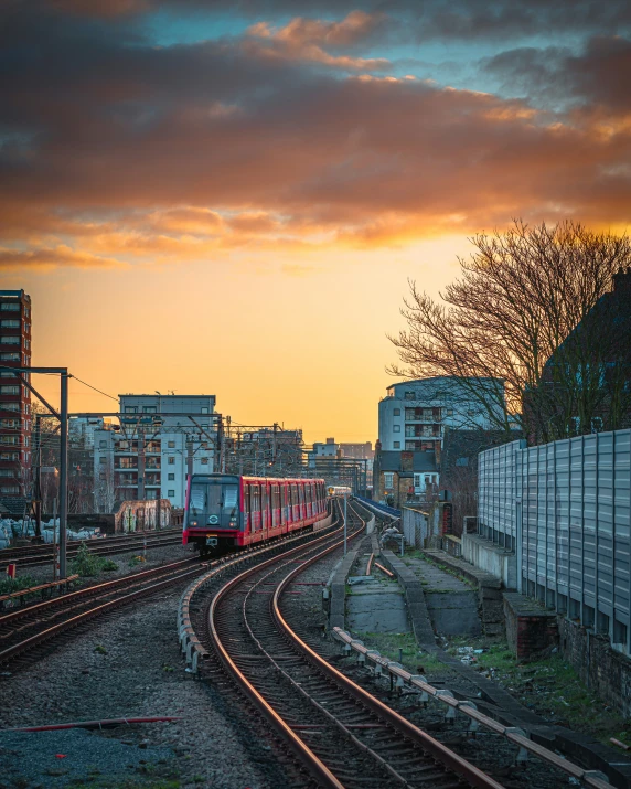 a sunset in the city with many tracks