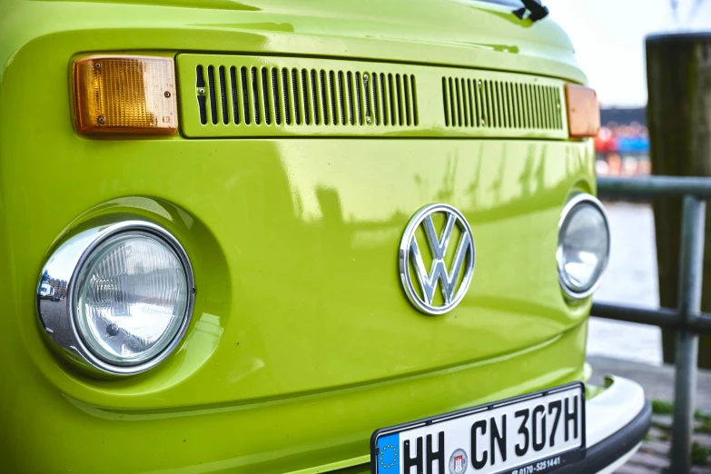 an old green van is shown with the emblem on it