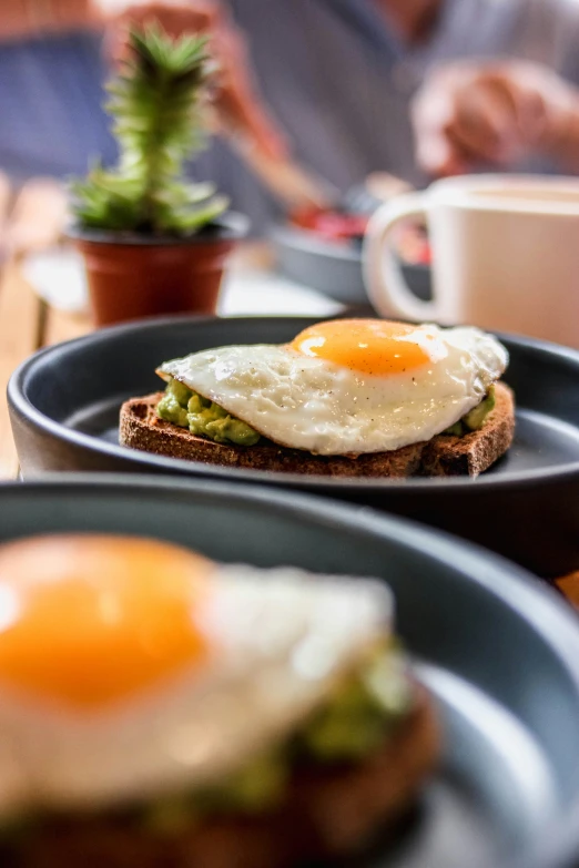 an open face sandwich with two fried eggs on it