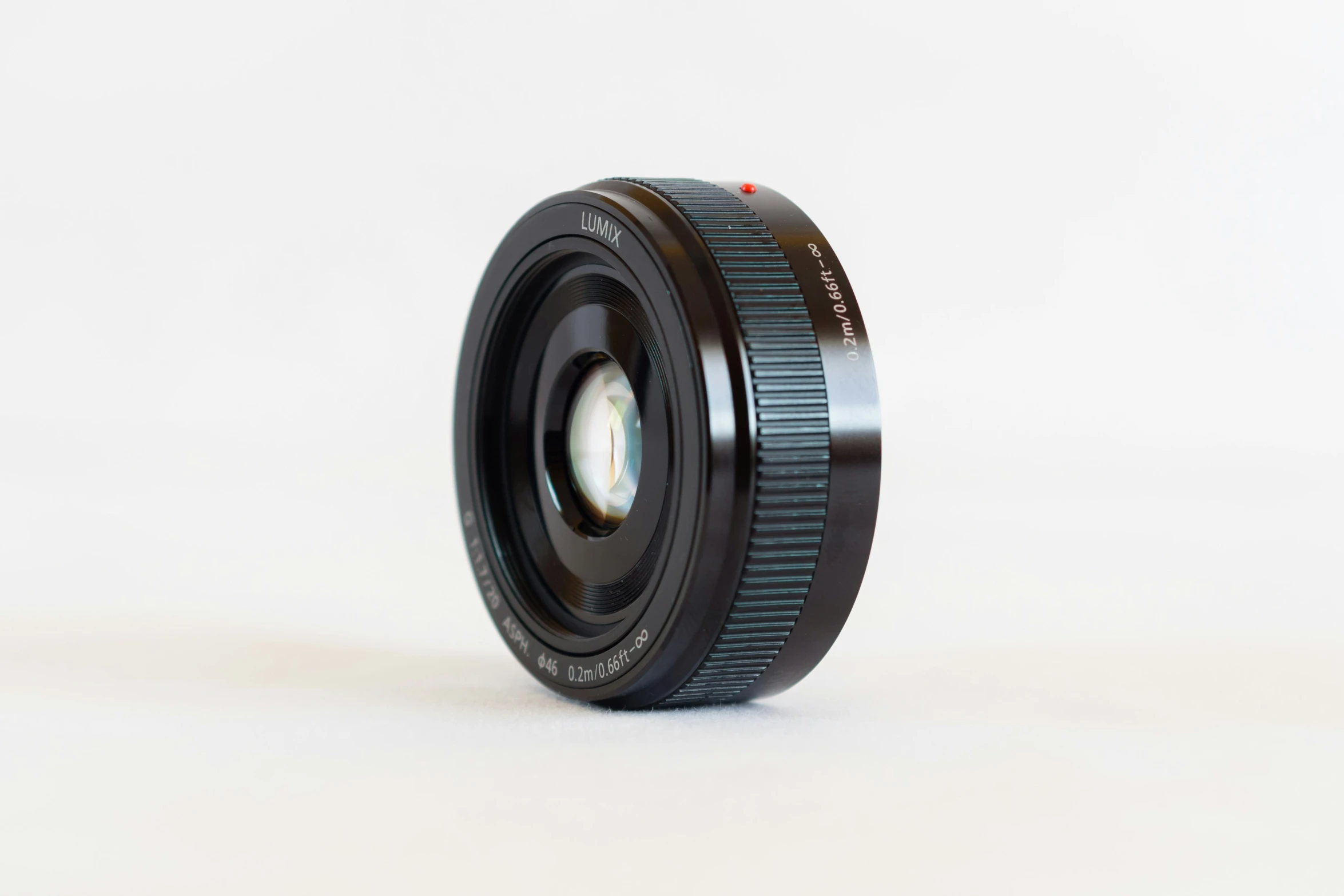 a canon camera lens is on display on a table