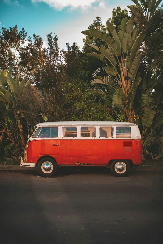 a bus is parked on the side of the road in a parking lot