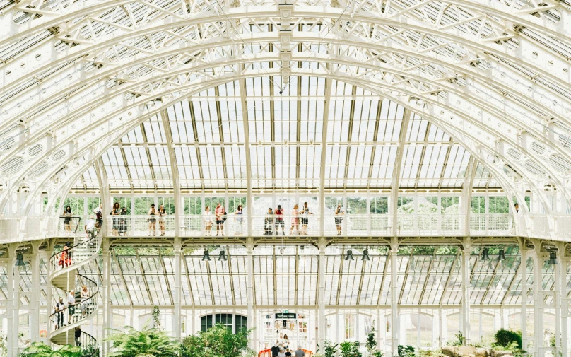 a large white building with a couple of walkways