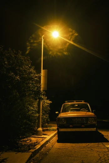 a car is parked in the street at night