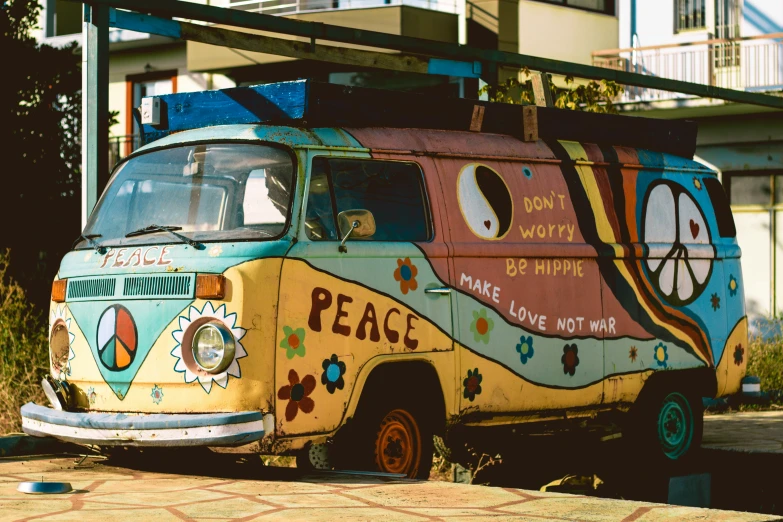 a multicolored bus sitting on the street