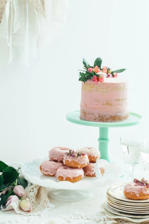 desserts on table with two large cake sitting on one of them