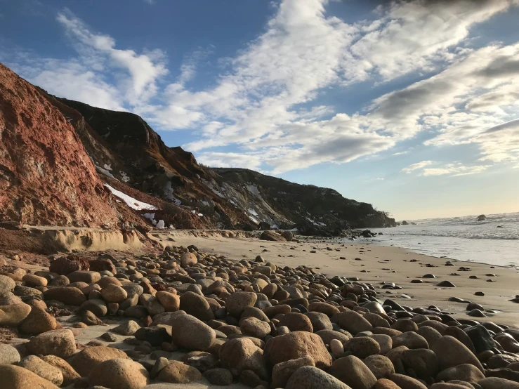 large rocks and boulders with ocean in the background