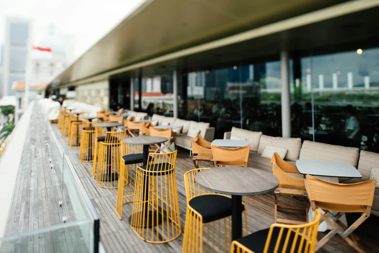 a patio with several tables and chairs on it