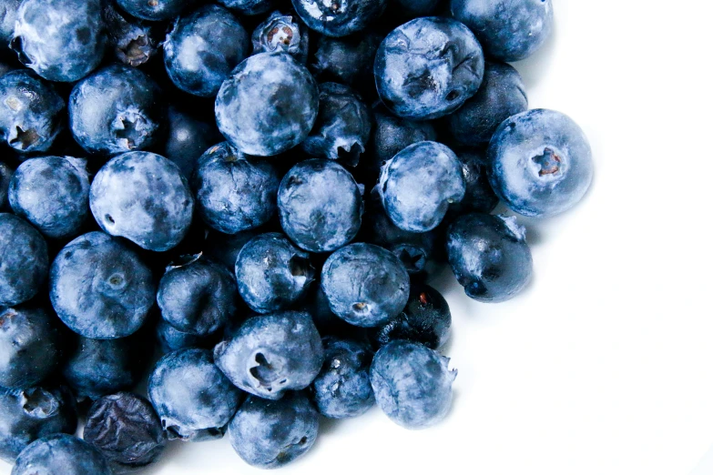 fresh blueberries piled up on top of each other