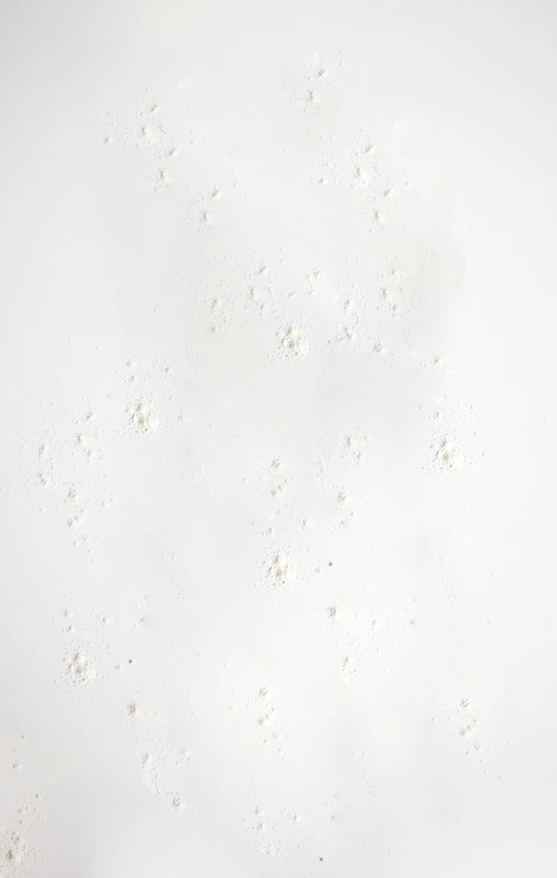 some white walls with small dots in the wall