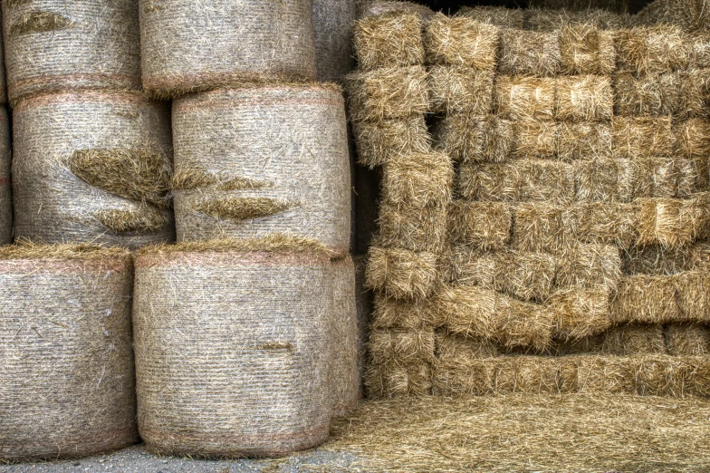 two stacks of hay stacked up next to each other
