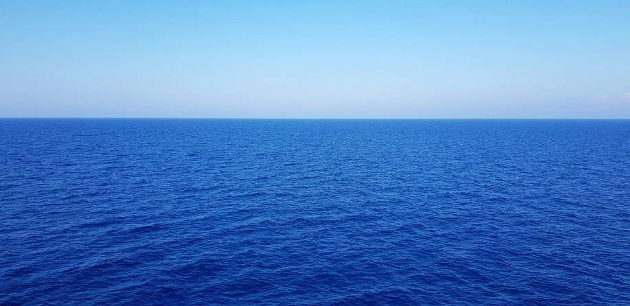 the ocean is blue and very wide, and it's blue