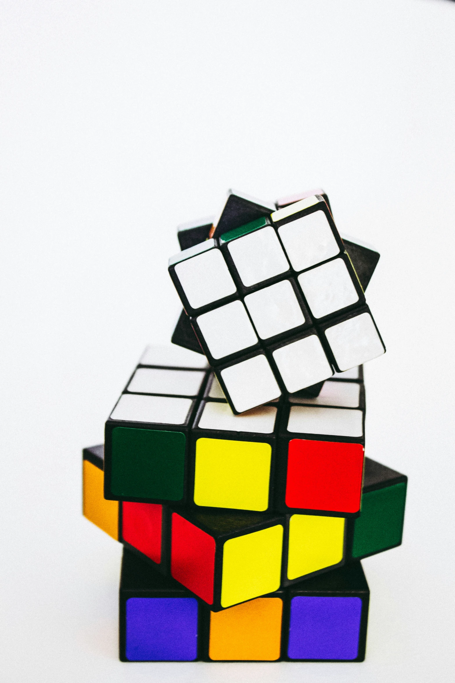 several rubiks stacked on top of one another