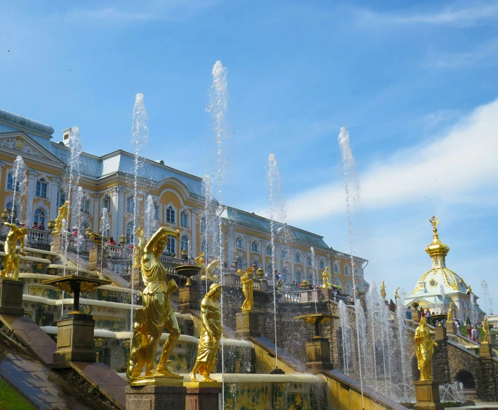 a large water fountain in front of a building