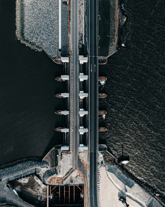 an aerial po of an urban street with some water