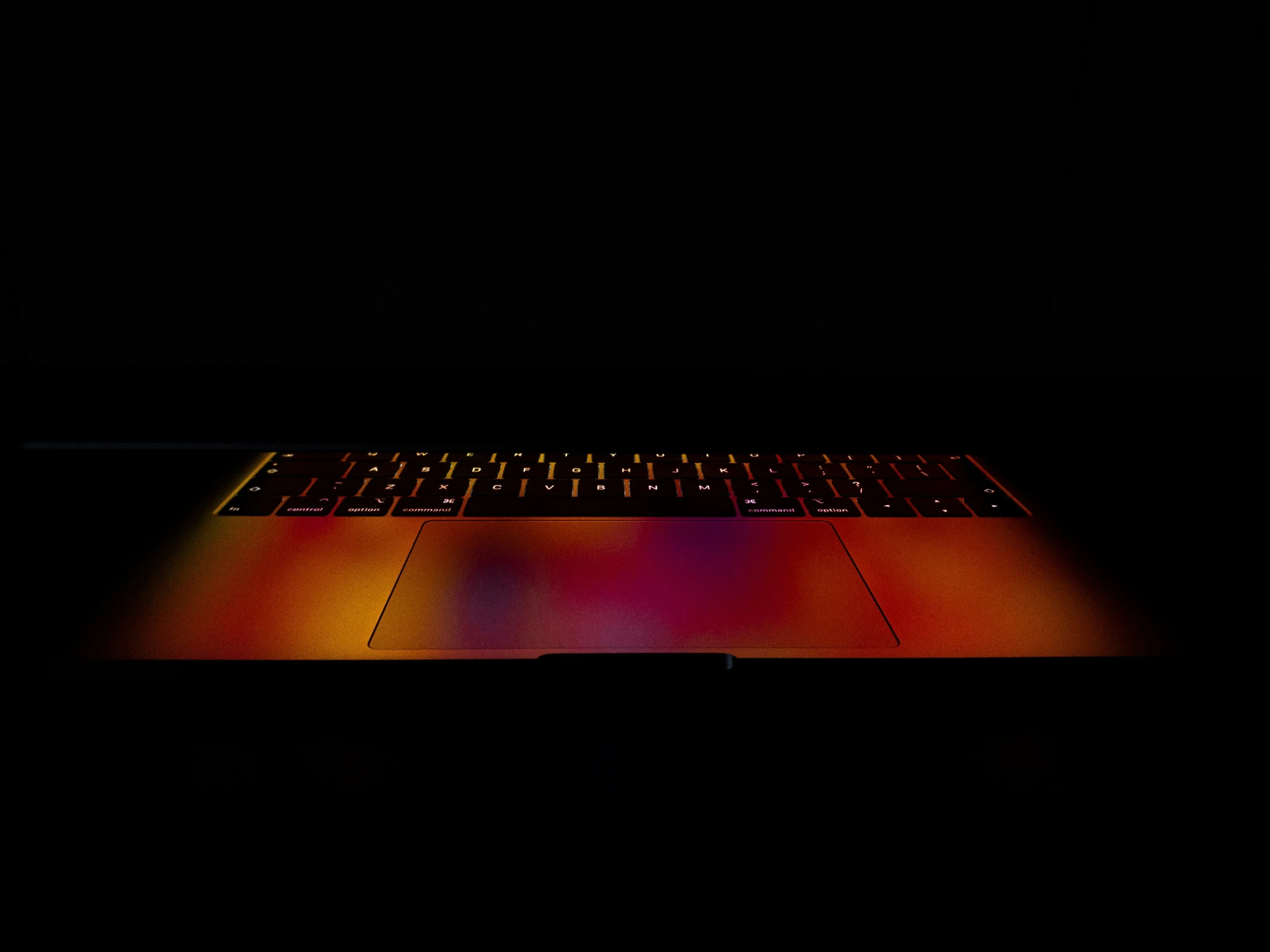 the backlight of a laptop computer on a table