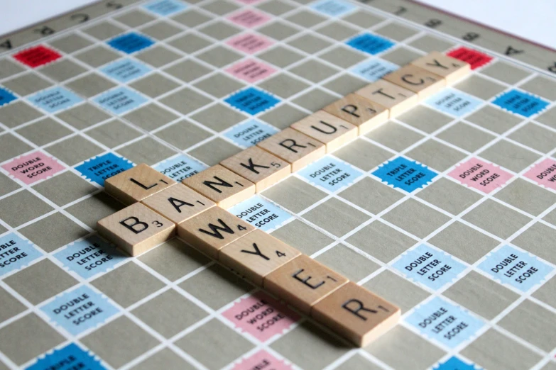 an interactive scrabble board with crossword pieces spelling the word bank