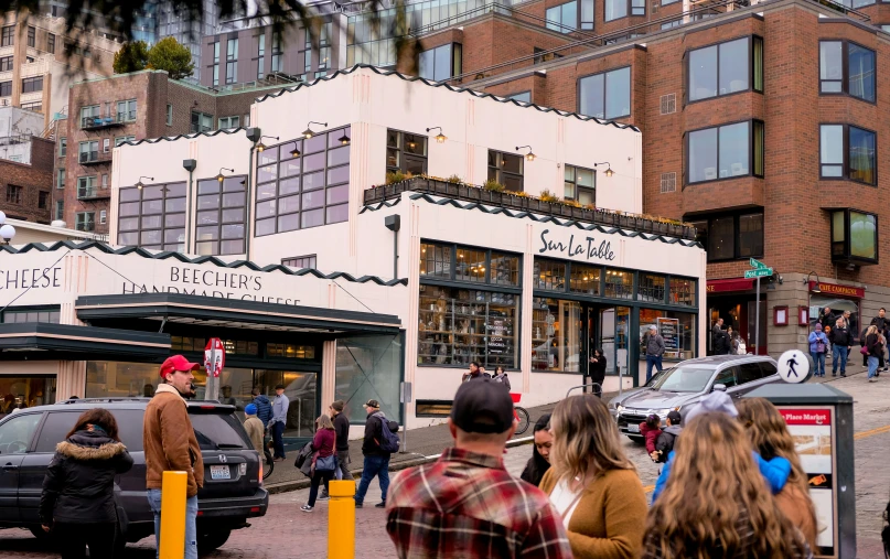 people gathered outside a store during the day