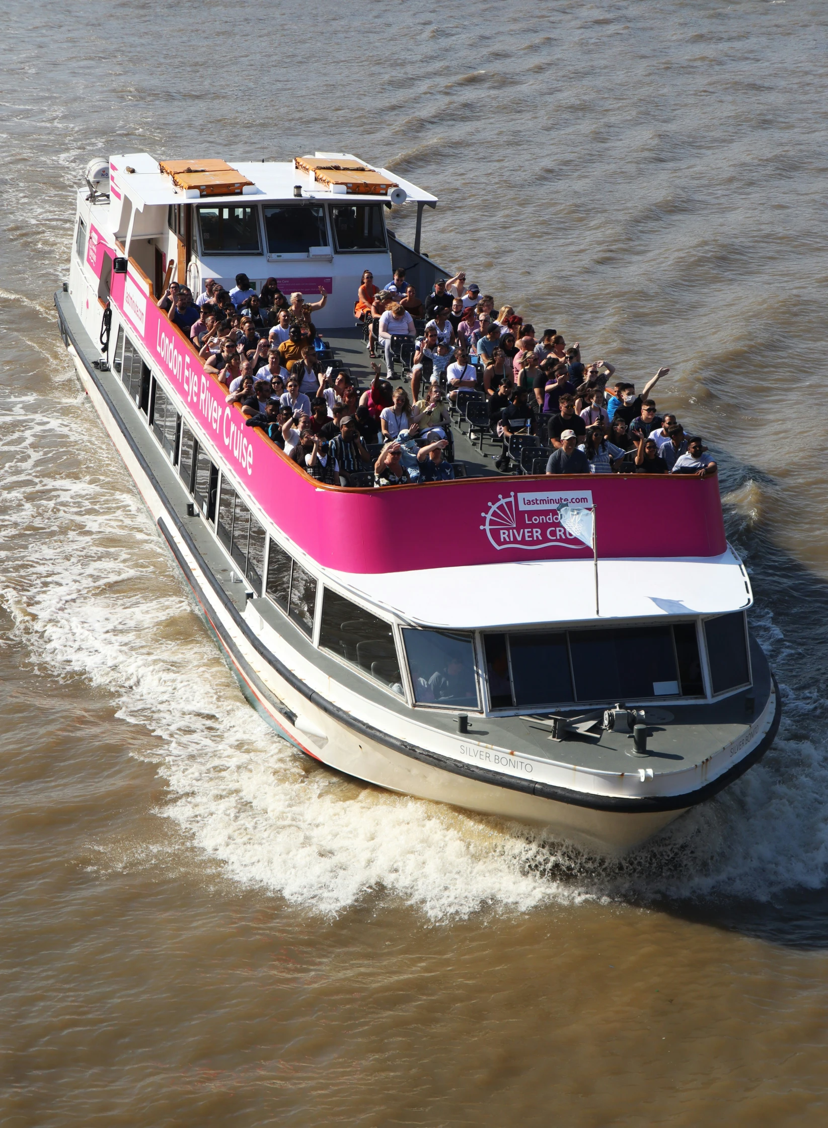 an aerial view of the boat's floating deck filled with a large group of people