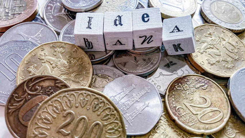 stack coins with a block labeled with the names of cities and capital on them