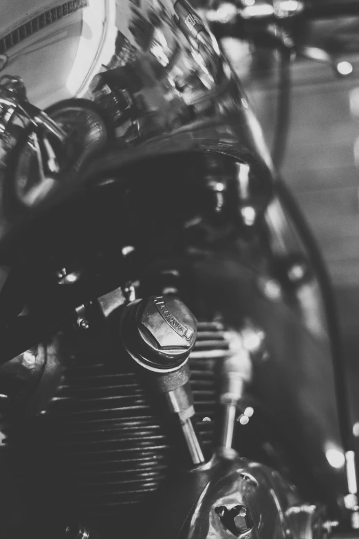 a close up of the handlebars and engine on a motorcycle