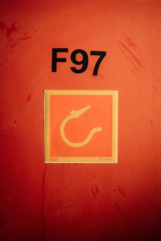 a square and yellow sticker with the number f97 written in english