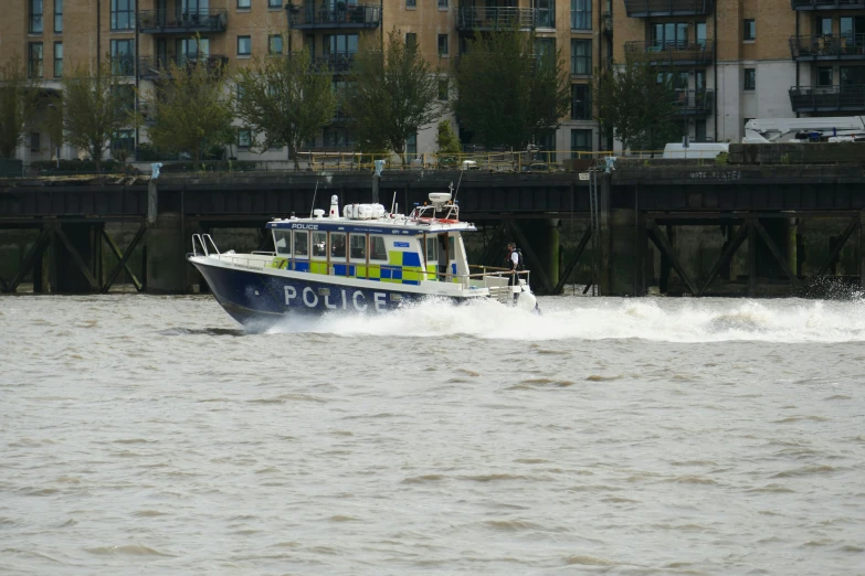 a police boat is traveling through the water