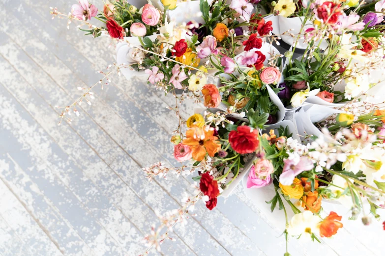 a pile of wildflowers with flowers growing