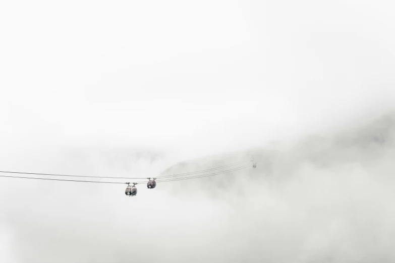 a pair of three wires running across the sky