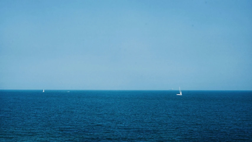 a group of sailboats out in the water