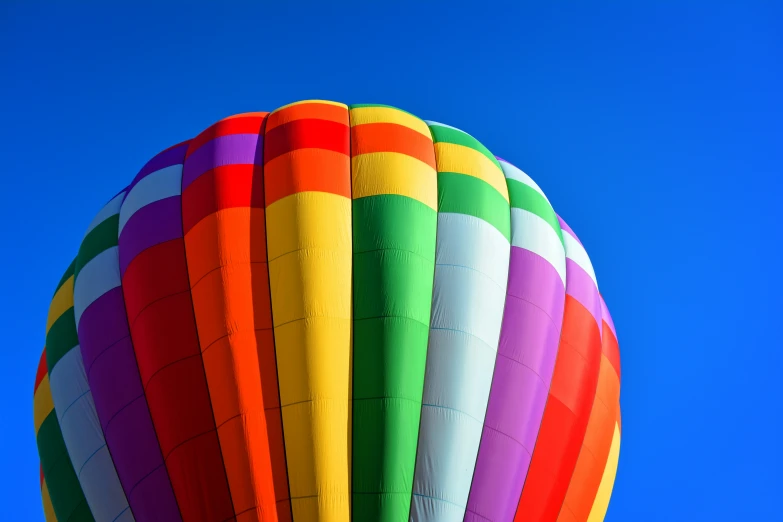 a colorful  air balloon flying through the sky