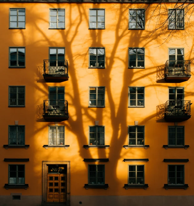 a building with many balconies and balconies on the windows