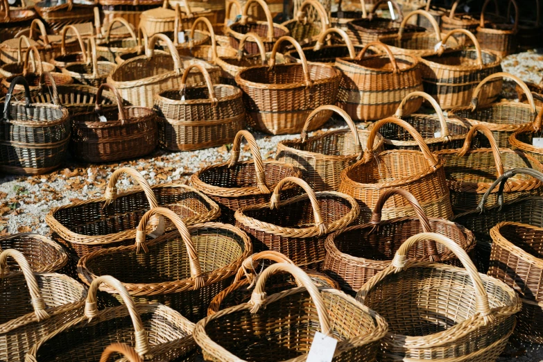 lots of wicker baskets sitting on the floor