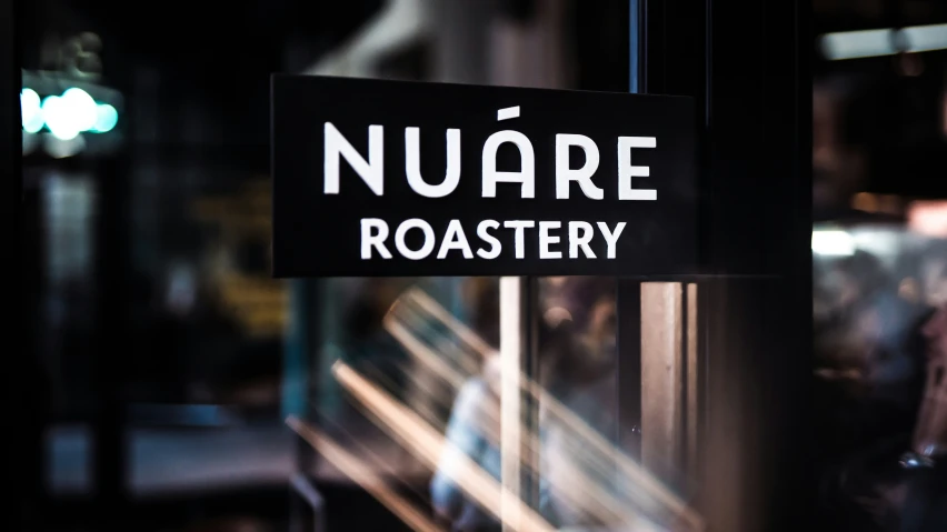 a street sign indicating that nuare roastery is closed