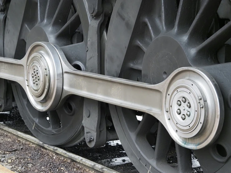 the wheels of a train that has stopped in a station