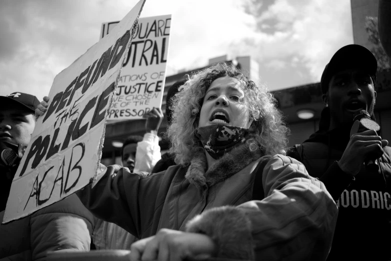 there is a protest with people holding signs