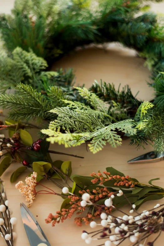 flowers and other foliage arranged to make a wreath