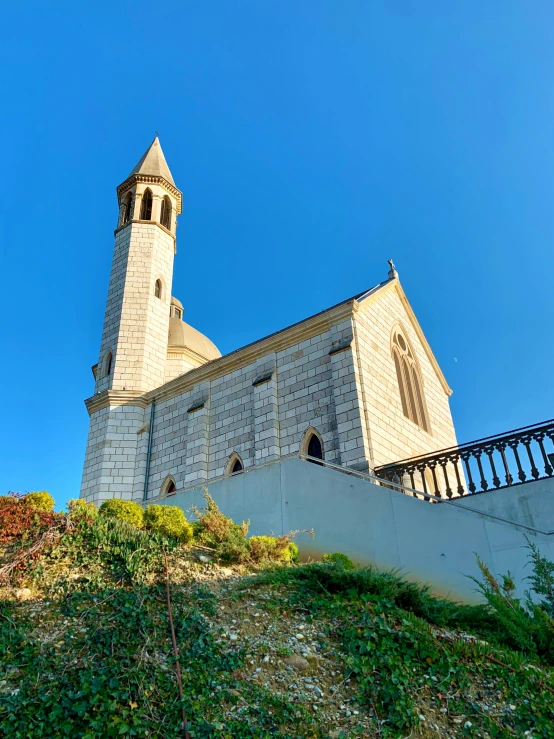 the steeples of an old church with an arched roof