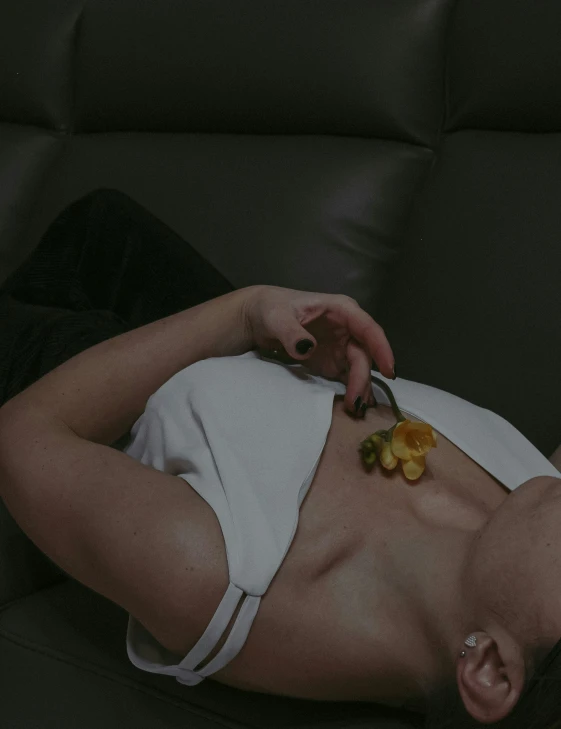 a lady laying down on her stomach eating food