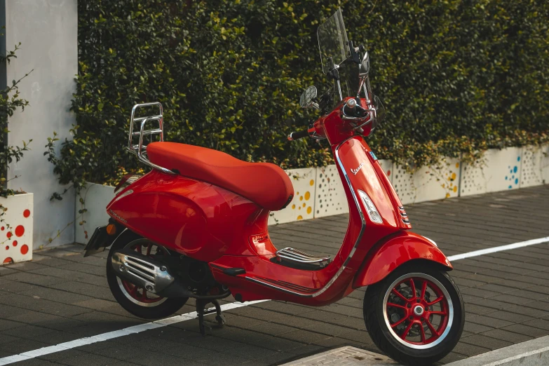 a red motorcycle that is parked outside