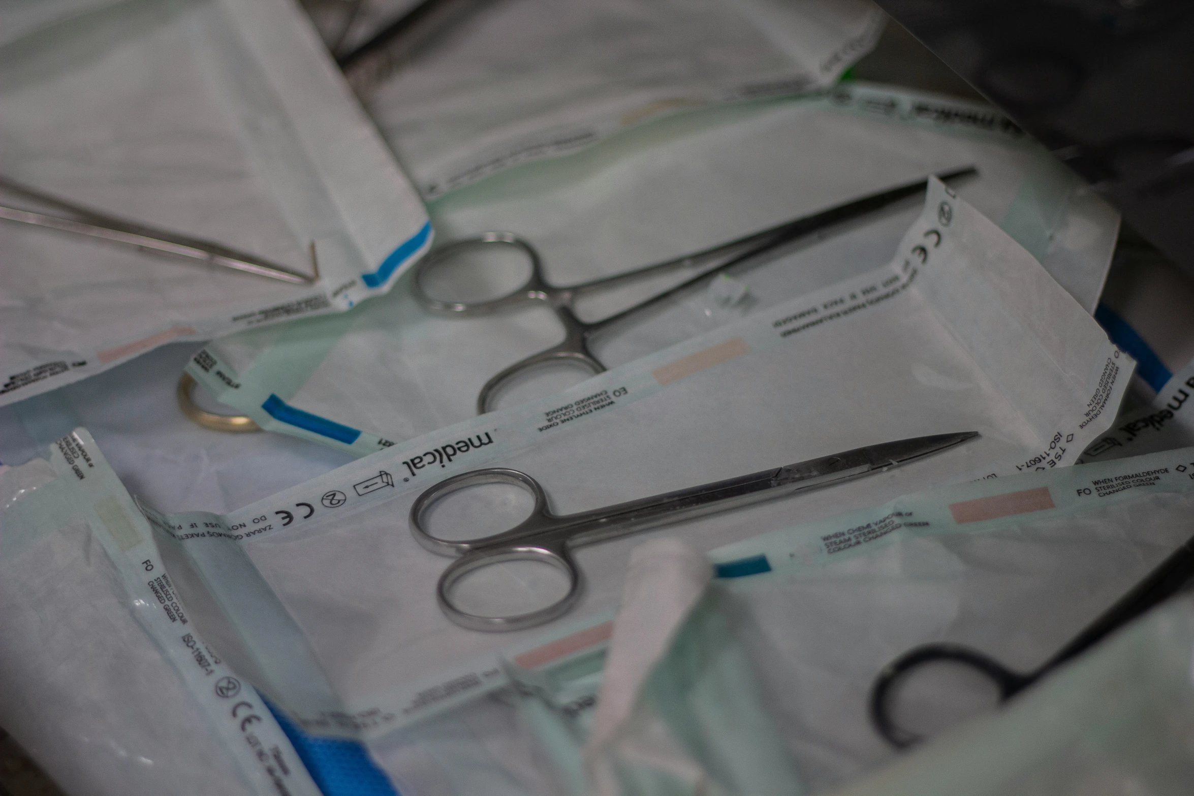 scissors and medical supplies are laying next to each other