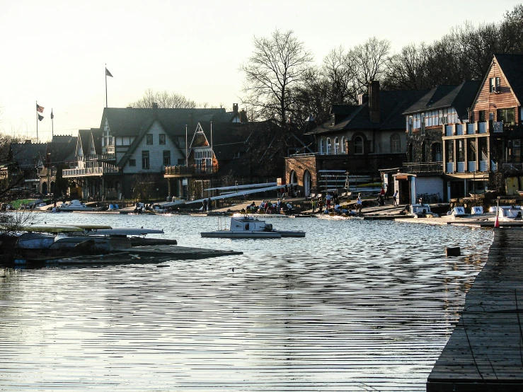 a river next to several small houses near the water