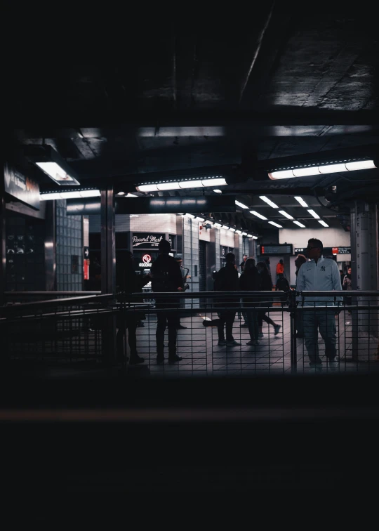 people on the subway waiting at a stop light