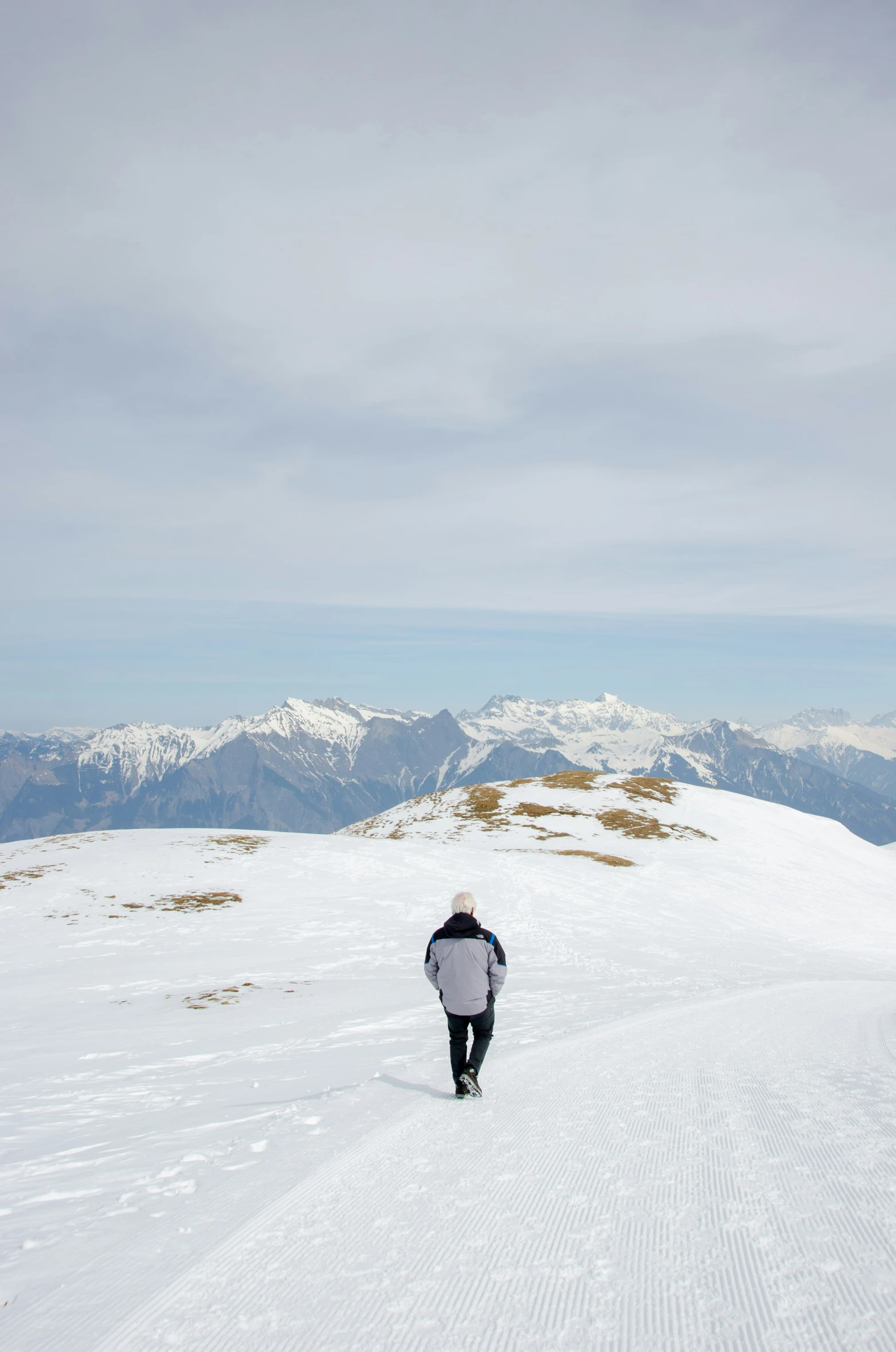 snowboarder on a snowy mountain top at high speed