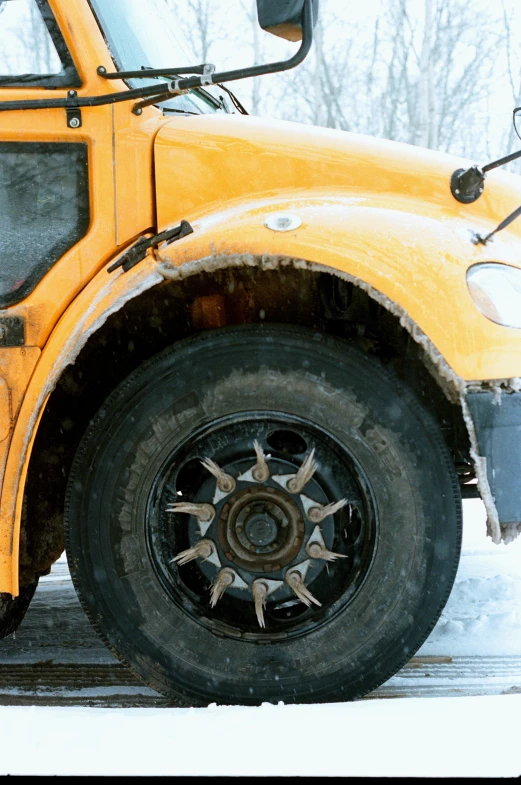 the front of a school bus with snow on the ground